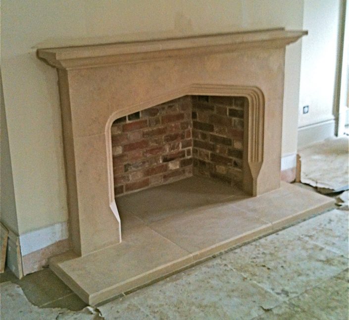Bathstone Fireplace with moulding running around arch